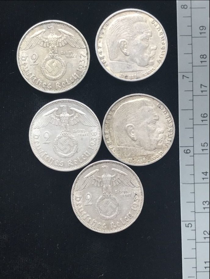 Nazi silver coin with Hindenburg and eagle from WWII in collector’s display