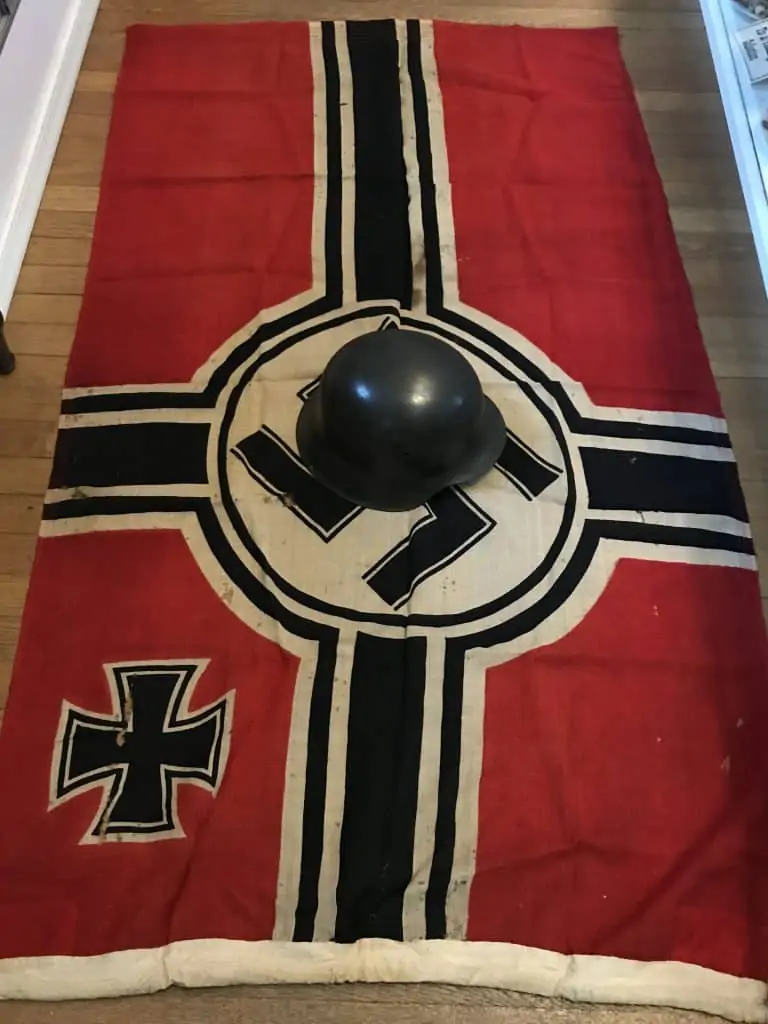 WWII German national war flag displayed vertically, part of the museum's war relic collection