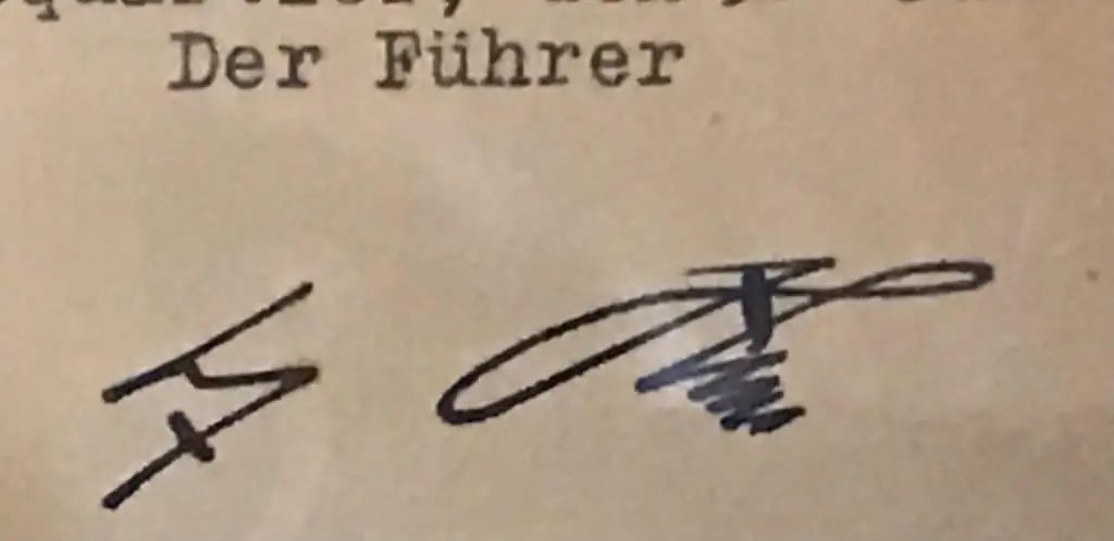 Close-up view of the document with signatures of Adolf Hitler and General Keitel