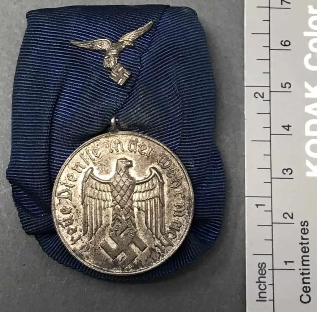 WWII German Four-Year Long Service Medal on parade mount, full view with ribbon