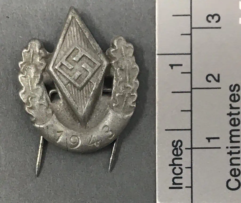 Original Hitler Youth HJ award badge from 1943 Reich Sports Competition recognizing Hitler Youth sports achievements.