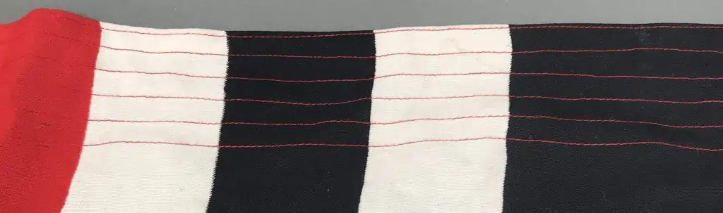 Close-up of WWII German Reichskriegsflagge design, a historical artifact on display