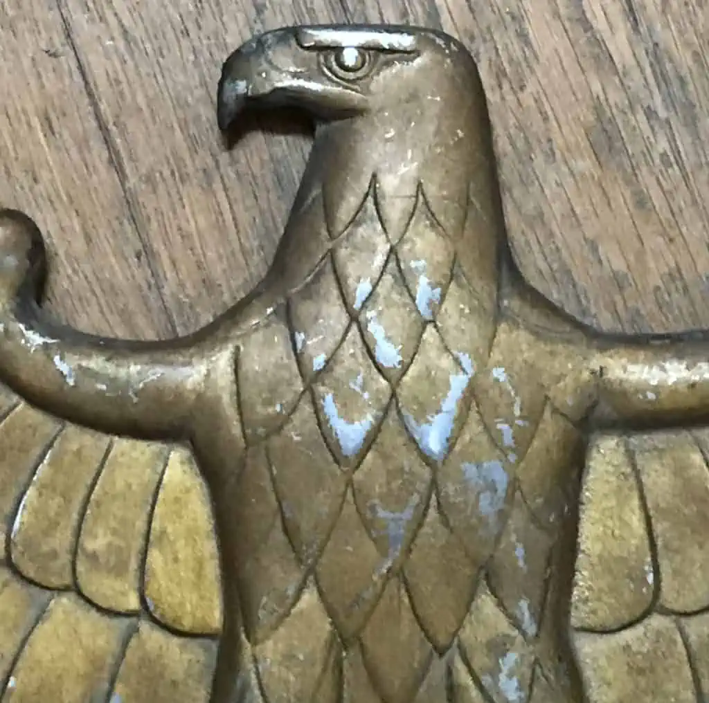 Close-up of WWII German railroad eagle showing detailed feathers and swastika emblem