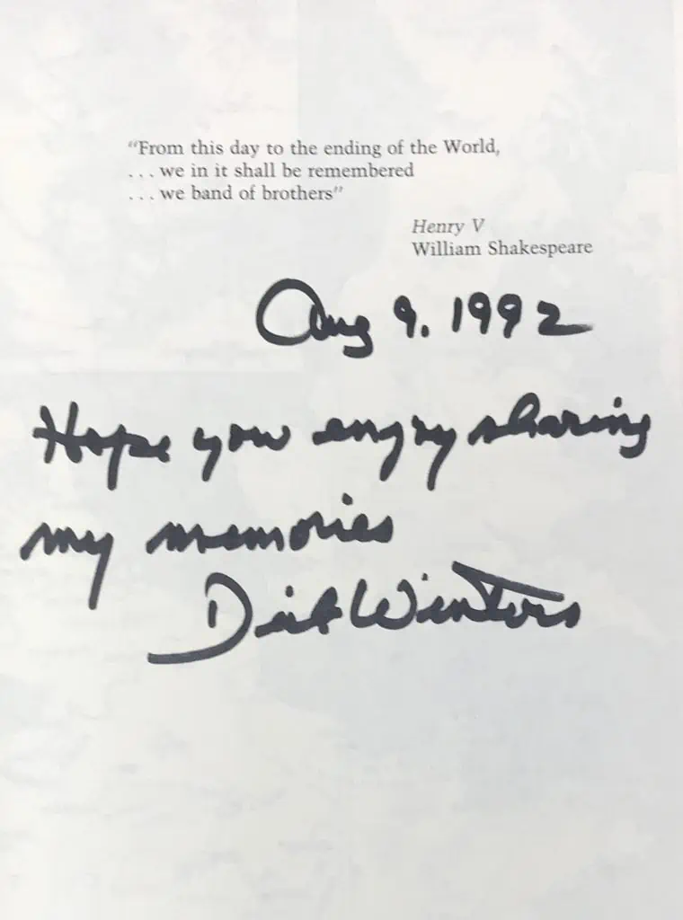 Side view of the signed first edition 'Band of Brothers' book by Major Dick Winters, part of a historical collection