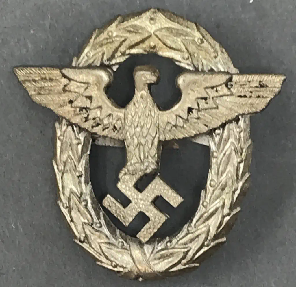 Close-up view of the Nazi Party Type 1 police visor cap eagle, certified relic on display at the museum