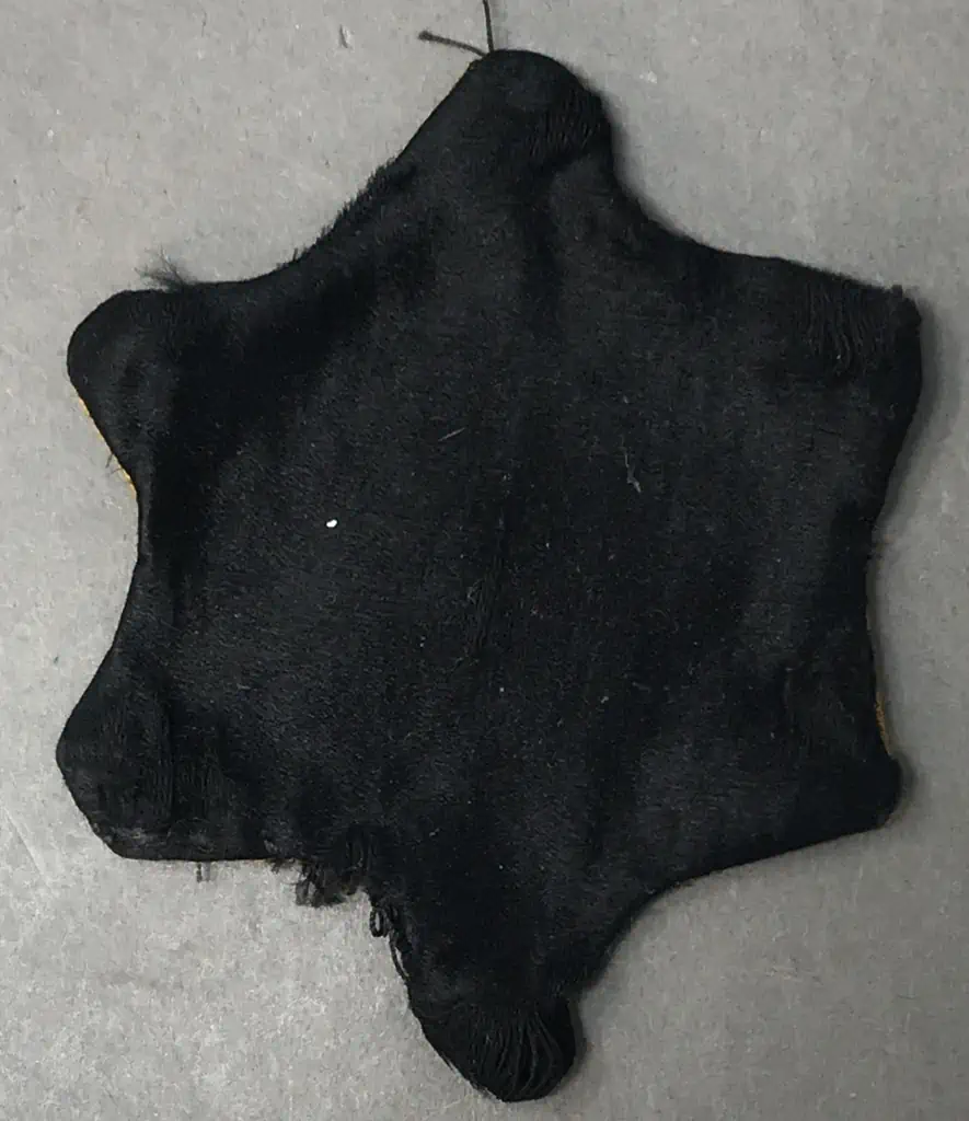 Front view of the Star of David badge worn by Jews during the Holocaust, displayed at the Gettysburg Museum