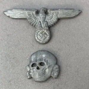 OUTSTANDING Original WWII German SS Visor Cap Skull And Eagle Matching Set By E.W. Assmann Certified By The Gettysburg Museum Of History.